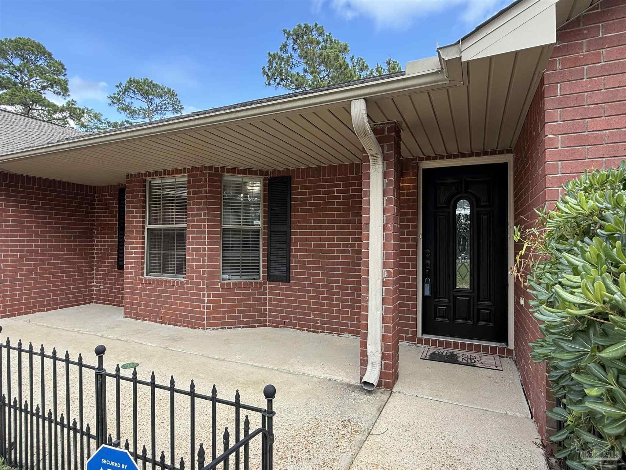 12465 Red Cloud Road Pensacola, FL 32507 - Photo 2 of 68 a front view of a house
