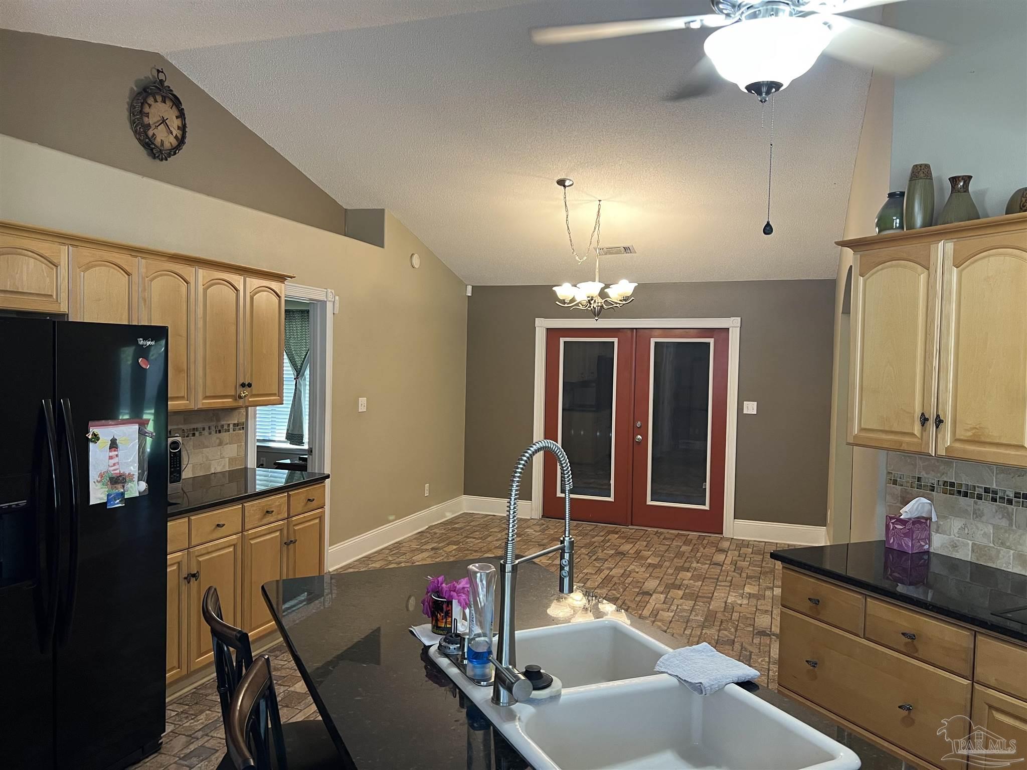 12465 Red Cloud Road Pensacola, FL 32507 - Photo 24 of 68 a view of a dining room with furniture and chandelier