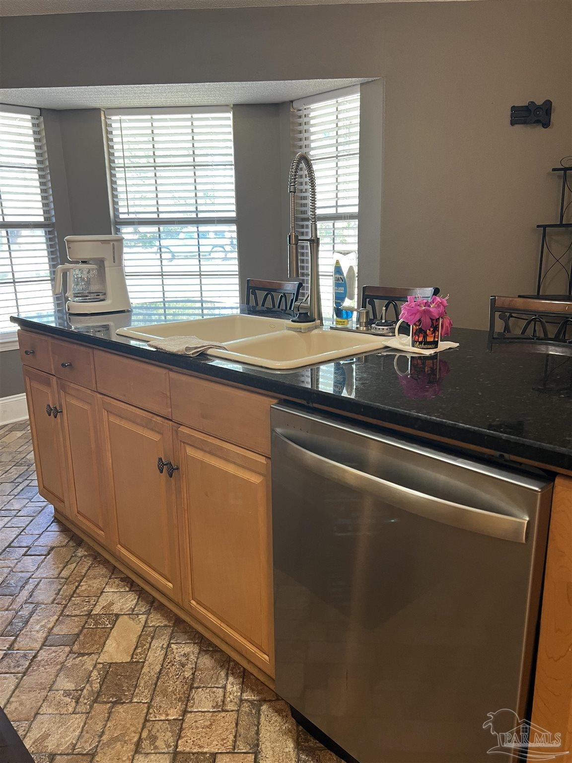 12465 Red Cloud Road Pensacola, FL 32507 - Photo 26 of 68 a kitchen with granite countertop cabinets and window