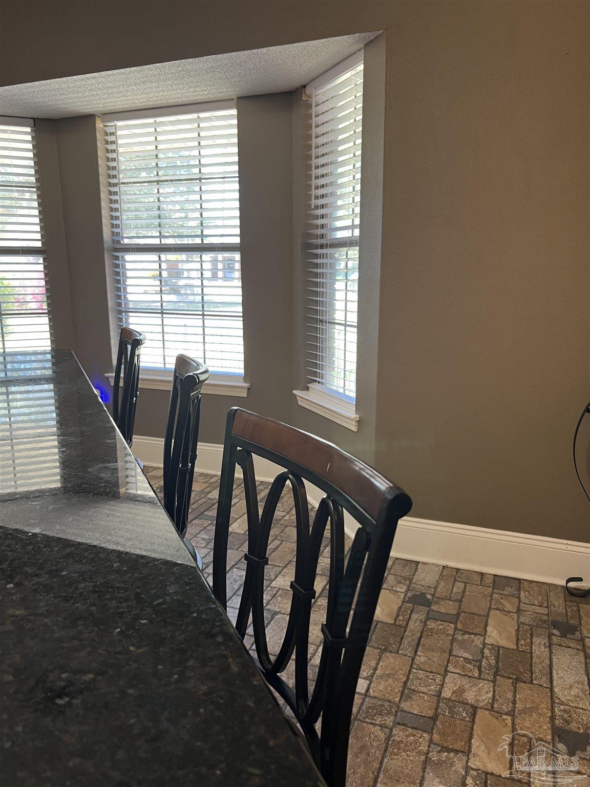 12465 Red Cloud Road Pensacola, FL 32507 - Photo 27 of 68 a view of a balcony with chair and table