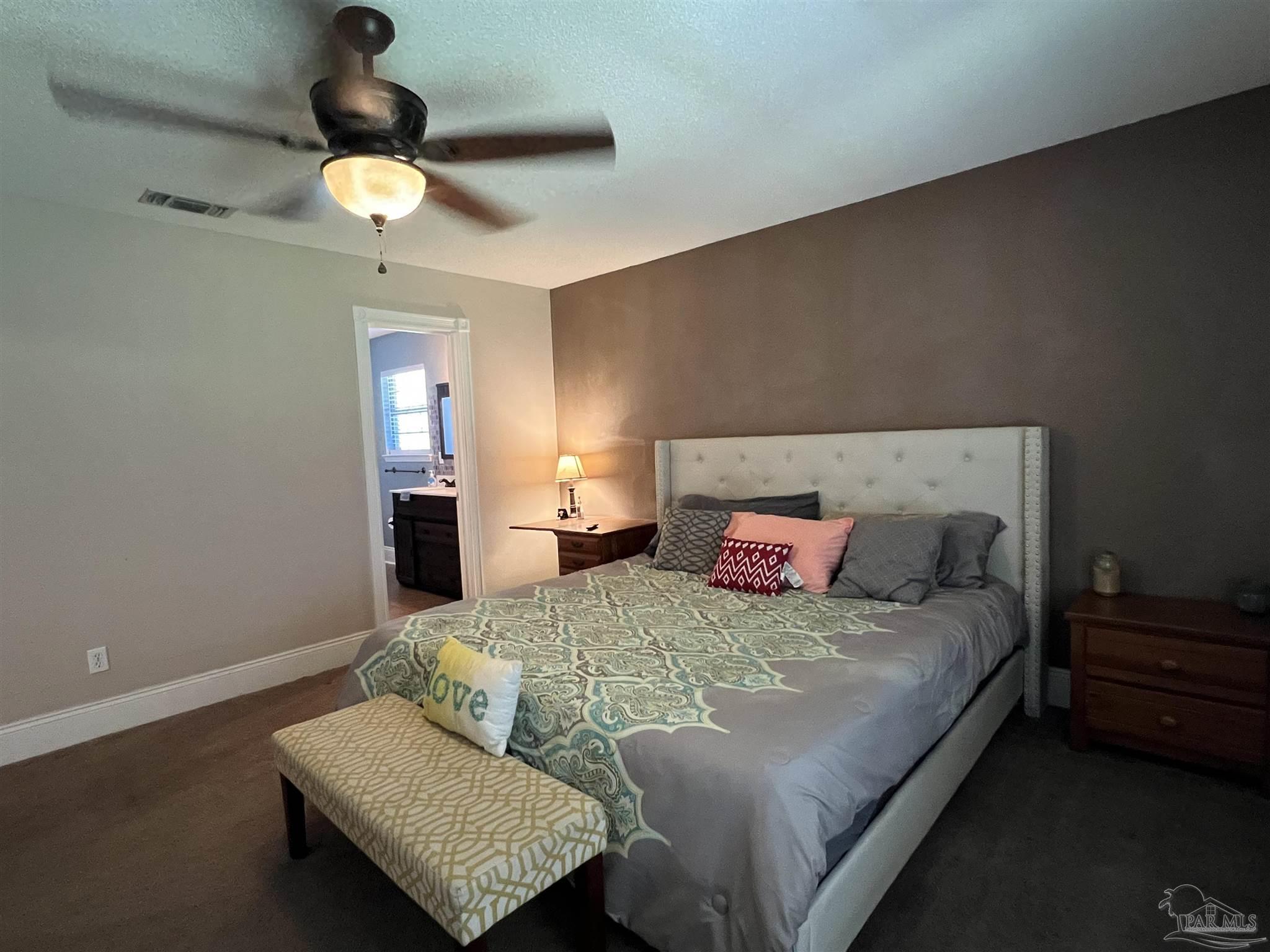 12465 Red Cloud Road Pensacola, FL 32507 - Photo 36 of 68 a bedroom with a bed flowerpot and window