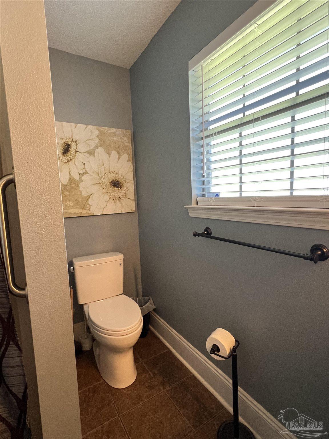 12465 Red Cloud Road Pensacola, FL 32507 - Photo 41 of 68 a white toilet sitting next to a window