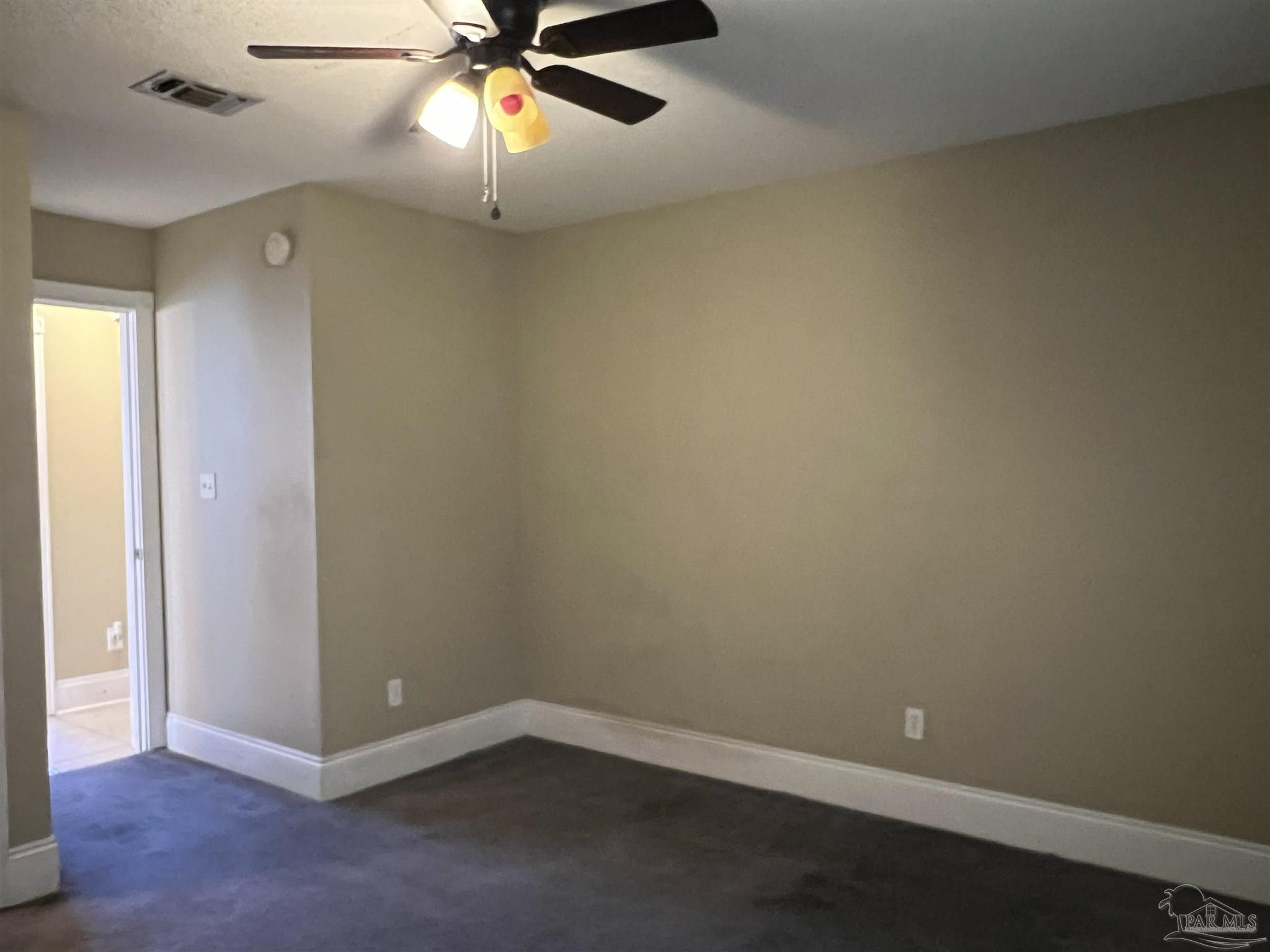12465 Red Cloud Road Pensacola, FL 32507 - Photo 50 of 68 an empty room with closet and a chandelier fan