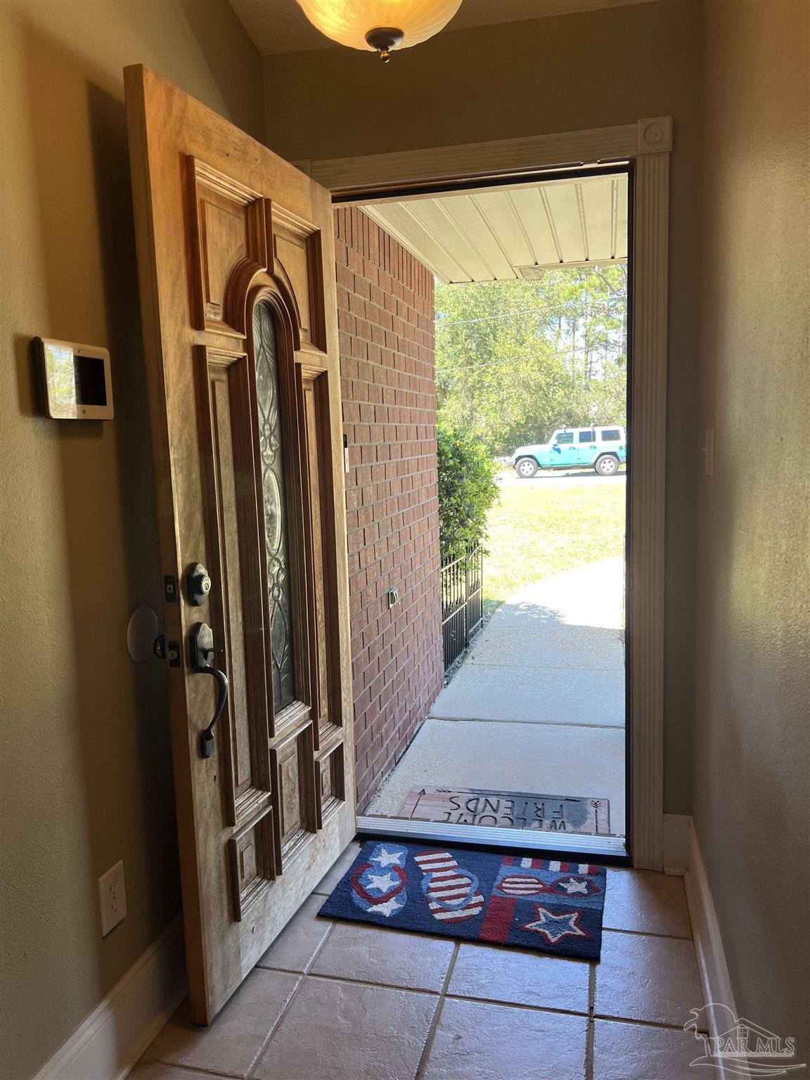 12465 Red Cloud Road Pensacola, FL 32507 - Photo 5 of 68 a view of a entryway door of the house