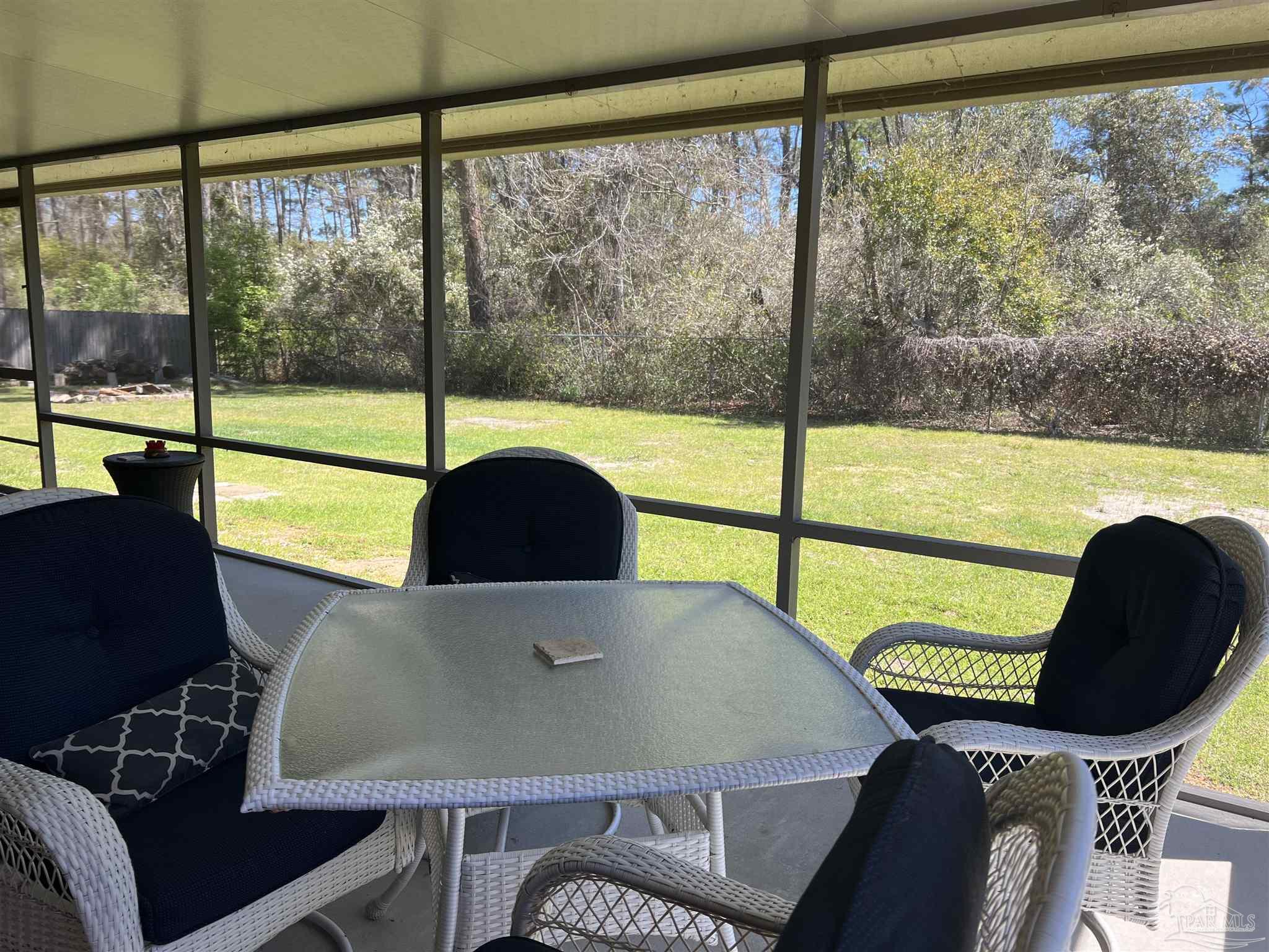 12465 Red Cloud Road Pensacola, FL 32507 - Photo 55 of 68 a view of a dining room with furniture window and outside view