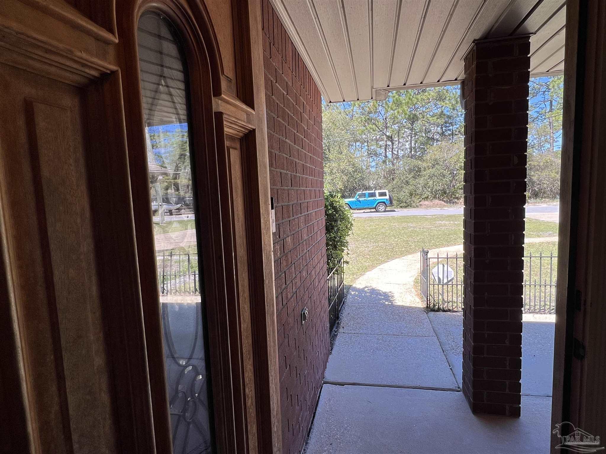 12465 Red Cloud Road Pensacola, FL 32507 - Photo 65 of 68 a view of balcony and floor to ceiling window