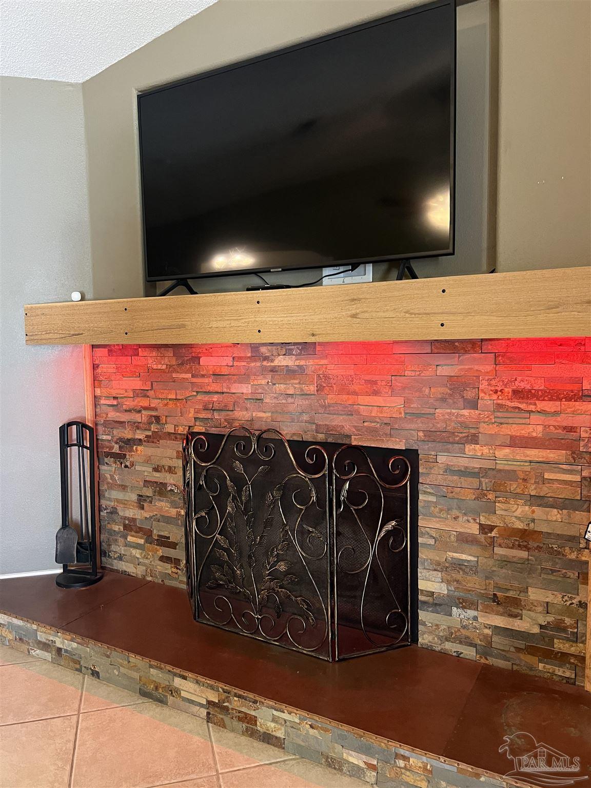 12465 Red Cloud Road Pensacola, FL 32507 - Photo 9 of 68 a view of a fireplace with an outdoor space