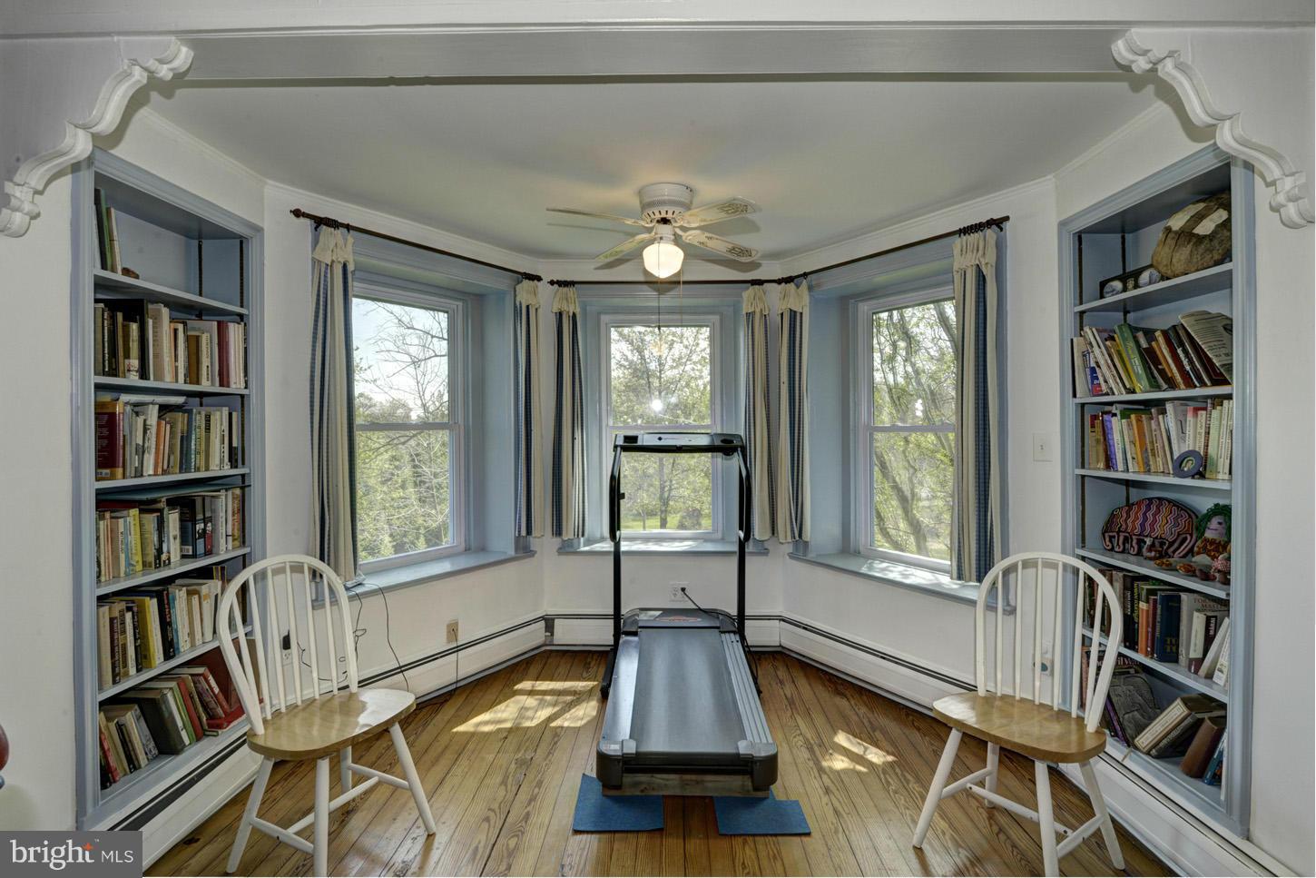 16501 Comus Road Dickerson, MD 20842 - Photo 14 of 29 a living room with furniture a bookshelf and a large window