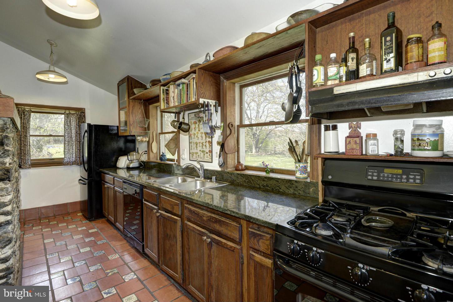16501 Comus Road Dickerson, MD 20842 - Photo 8 of 29 a kitchen with stainless steel appliances granite countertop a stove and a sink