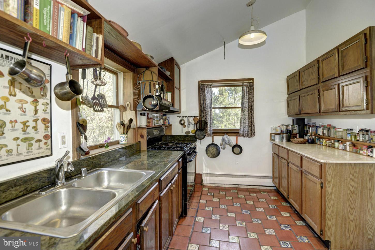 16501 Comus Road Dickerson, MD 20842 - Photo 9 of 29 a kitchen with a sink a stove and cabinets