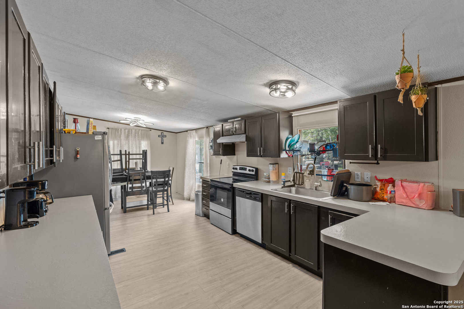 a kitchen with lots of counter top space and furniture