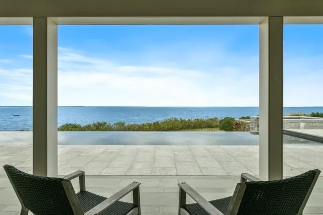 a view of a chair and table in the balcony