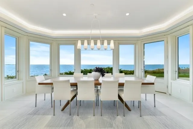 a room with lots of furniture and a large window