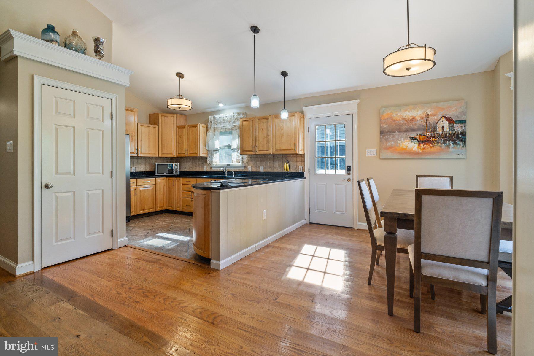 6715 West Lakeridge Road New Market, MD 21774 - Photo 10 of 50 Kitchen opens to massive deck overlooking lake