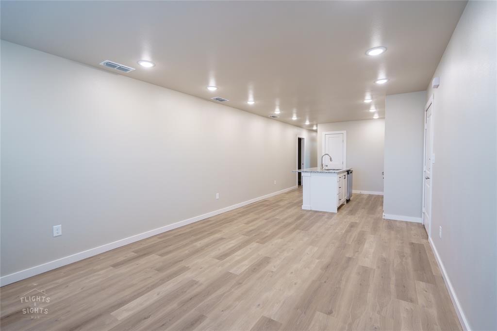 a view of a livingroom with a refrigerator