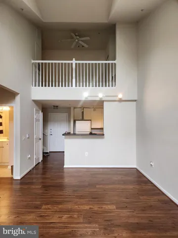 a view of livingroom and kitchen with wooden floor