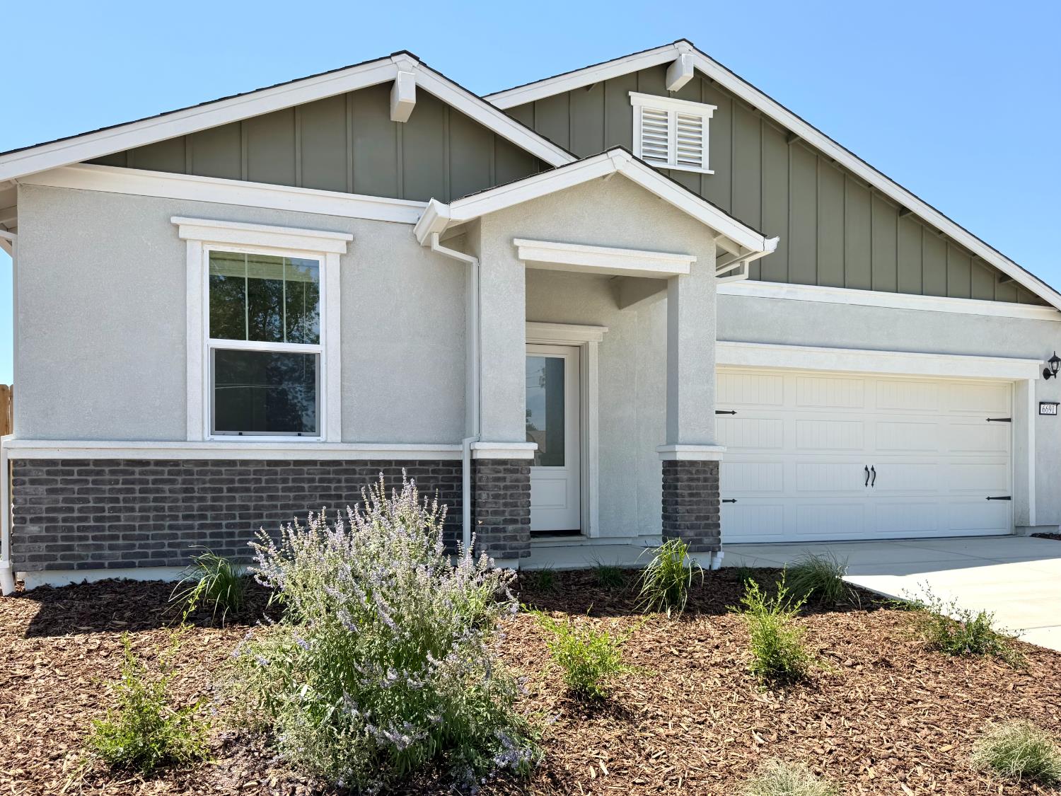 6691 Snedigar Road Riverbank, CA 95367 - Photo 2 of 12 a front view of a house with a yard