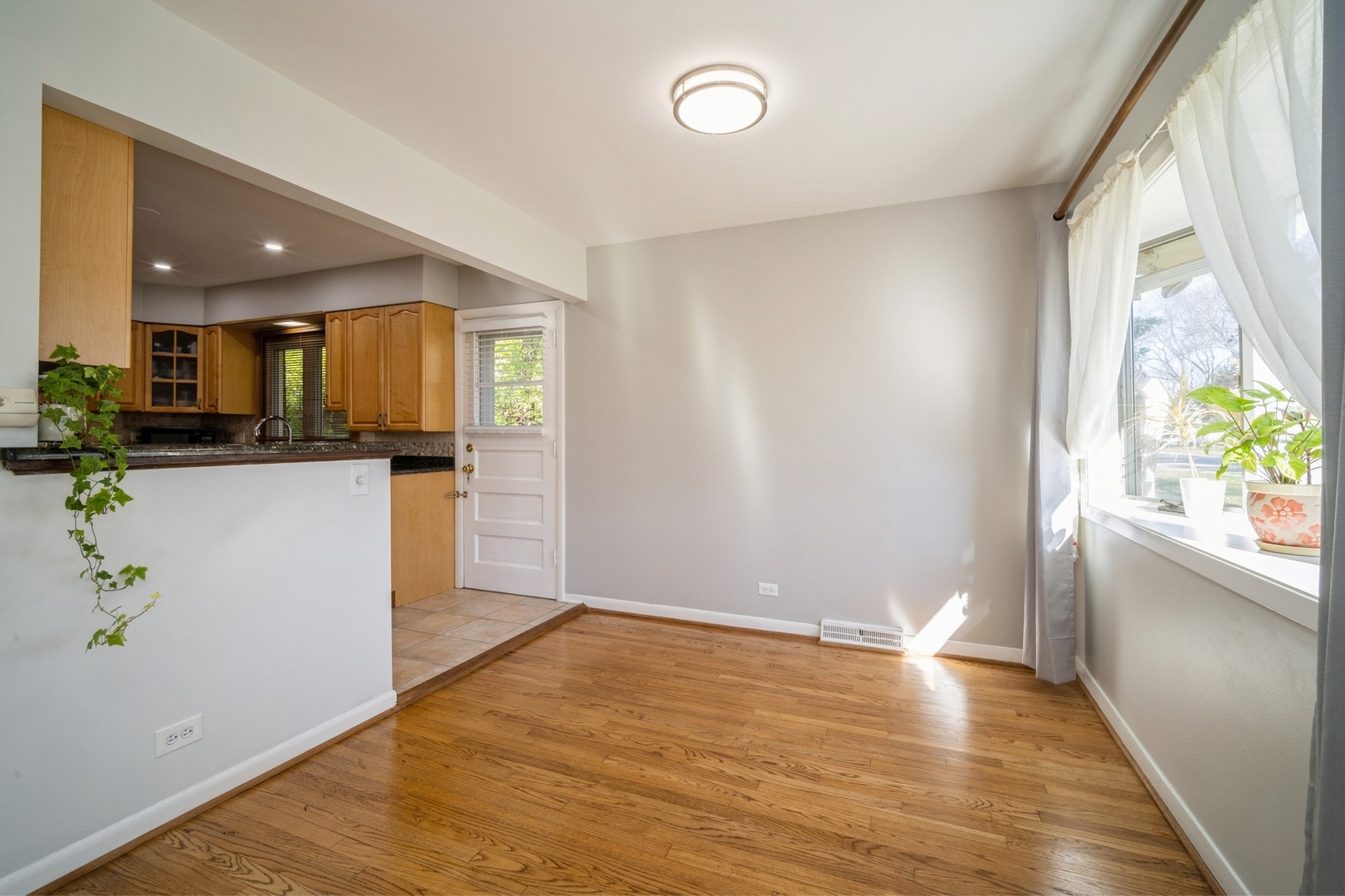 1450 Wescott Road Northbrook, IL 60062 - Photo 6 of 22 a view of a kitchen with wooden floor and a window