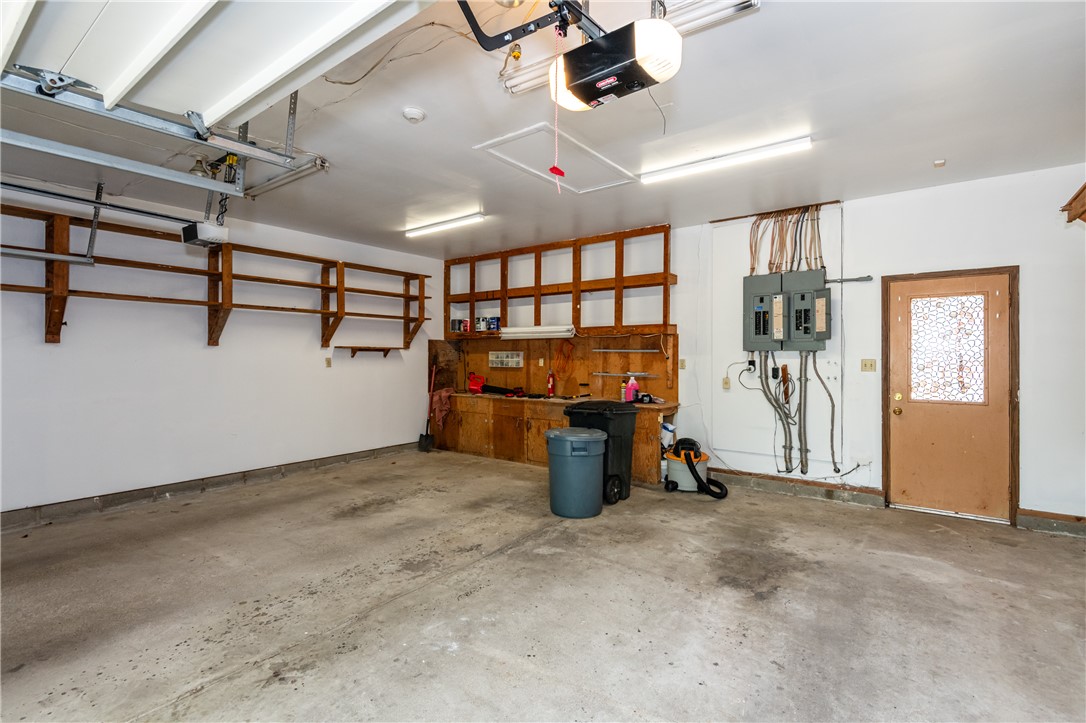 6750 Little Twin Road Germantown, OH 45327 - Photo 35 of 88 This spacious garage offers ample storage and a dedicated workbench area, ideal for projects.