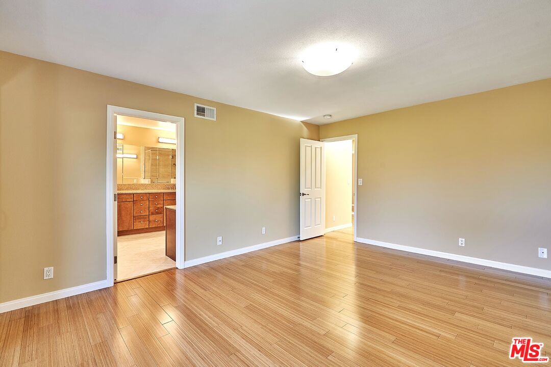 28227 Ridgepoint Court Rancho Palos Verdes, CA 90275 - Photo 12 of 34 a view of an empty room with wooden floor and a window