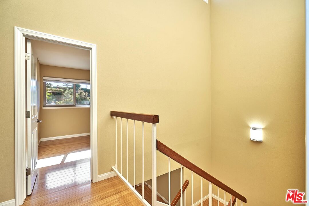 28227 Ridgepoint Court Rancho Palos Verdes, CA 90275 - Photo 15 of 34 a view of a hallway with wooden floor and a bathroom