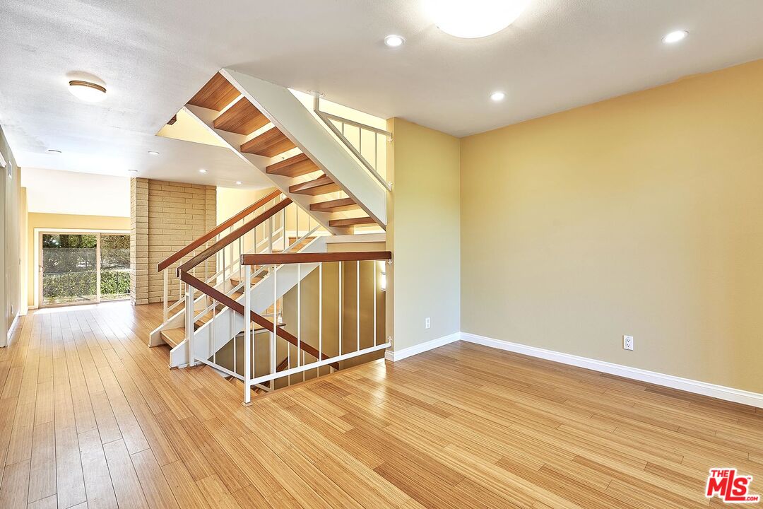 28227 Ridgepoint Court Rancho Palos Verdes, CA 90275 - Photo 22 of 34 a view of an empty room with wooden floor and stairs