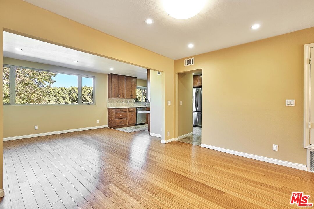 28227 Ridgepoint Court Rancho Palos Verdes, CA 90275 - Photo 24 of 34 a view of a kitchen with a fridge and wooden floor