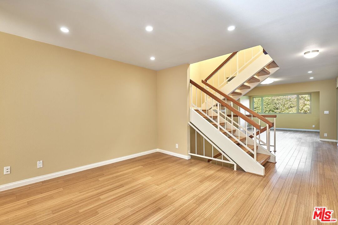 28227 Ridgepoint Court Rancho Palos Verdes, CA 90275 - Photo 31 of 34 a view of an empty room with wooden floor and stairs