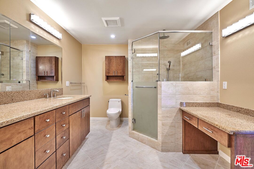 28227 Ridgepoint Court Rancho Palos Verdes, CA 90275 - Photo 9 of 34 a spacious bathroom with a granite countertop sink mirror and double