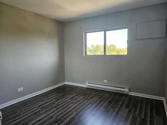 wooden floor and window in an empty room