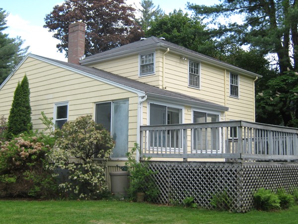 76 Sutton Road Needham, MA 02492 - Photo 4 of 18 a front view of a house with a garden