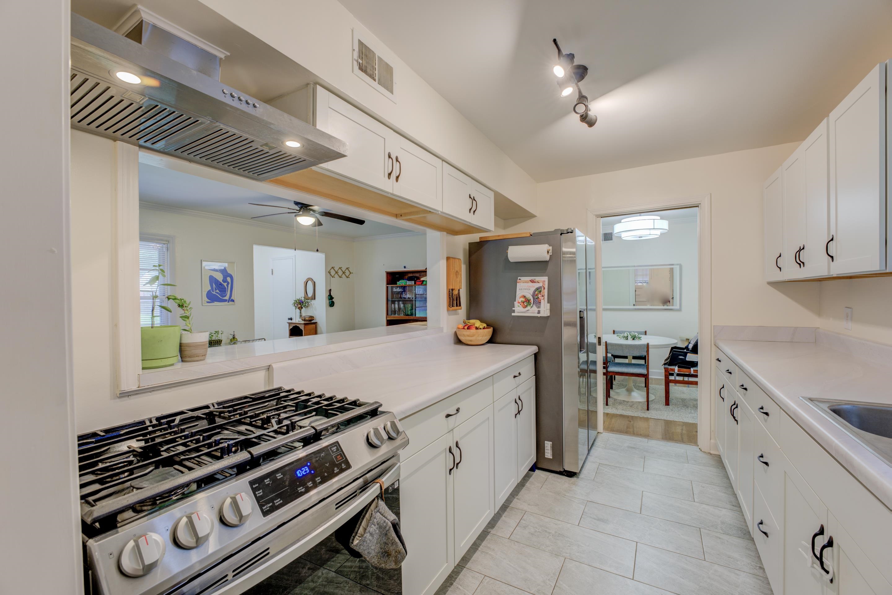 1223 Dearing Road Memphis, TN 38117 - Photo 7 of 34 a kitchen with stove and cabinets