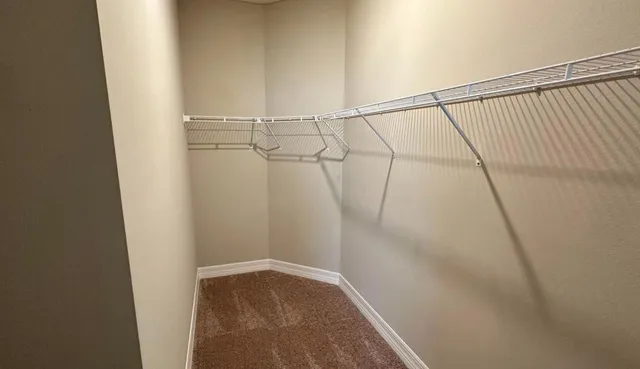 a view of a room with racks on the wall