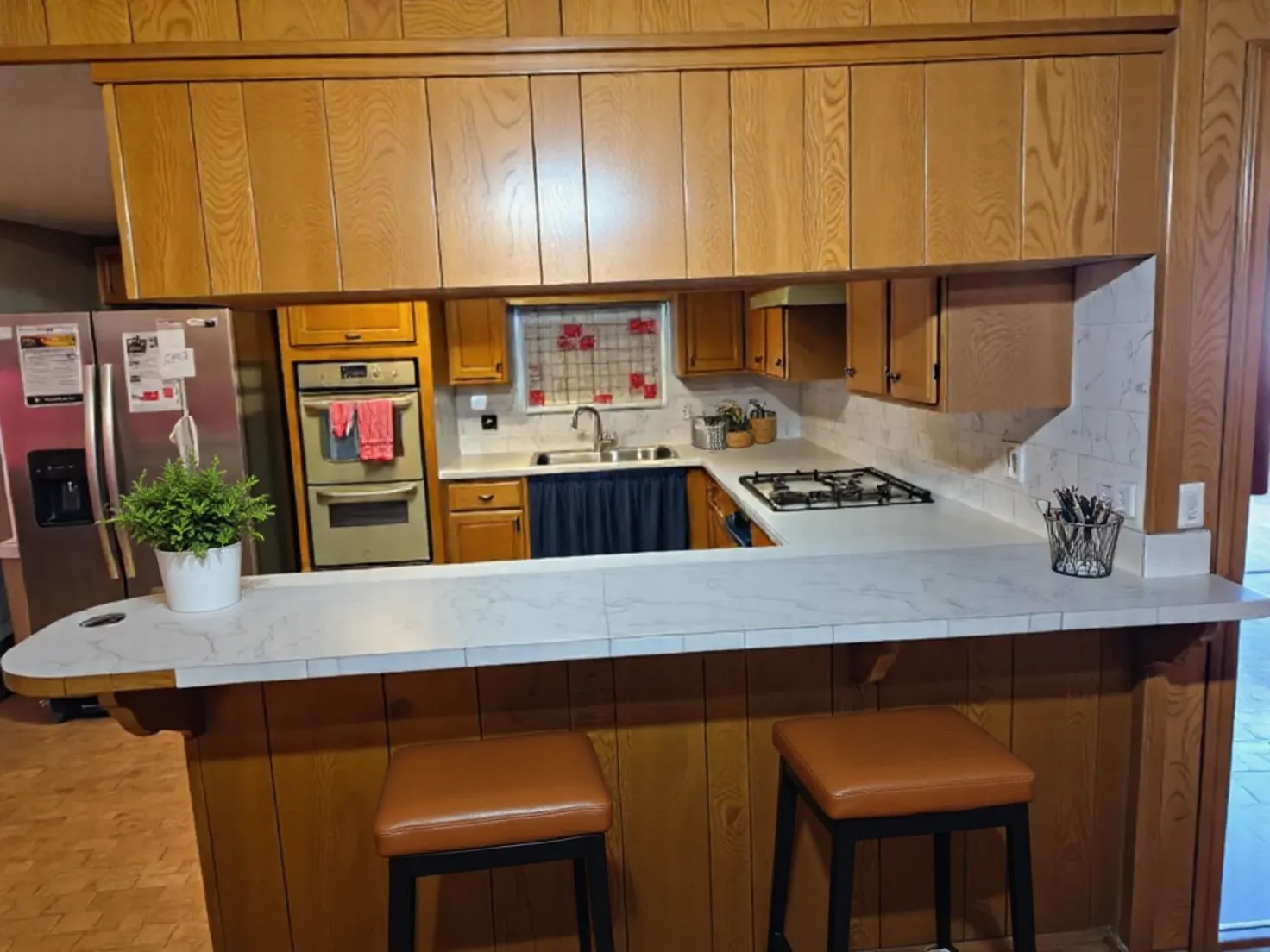 1305 2nd Street Hempstead, TX 77445 - Photo 13 of 24 a kitchen with stainless steel appliances a sink a stove and a refrigerator