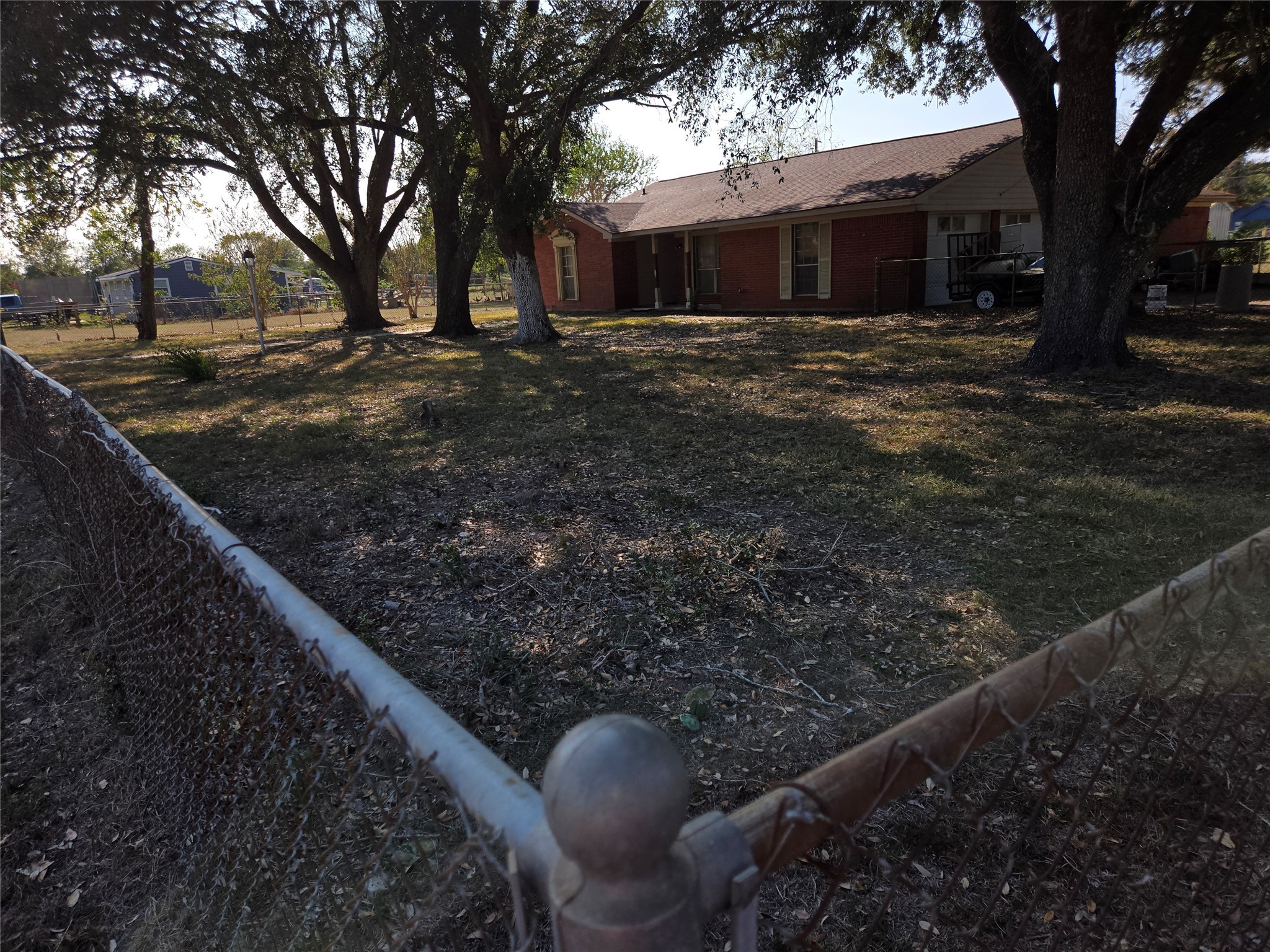 1305 2nd Street Hempstead, TX 77445 - Photo 23 of 24 a view of a house with backyard and trees