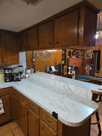 a kitchen with lots of appliances and cabinets