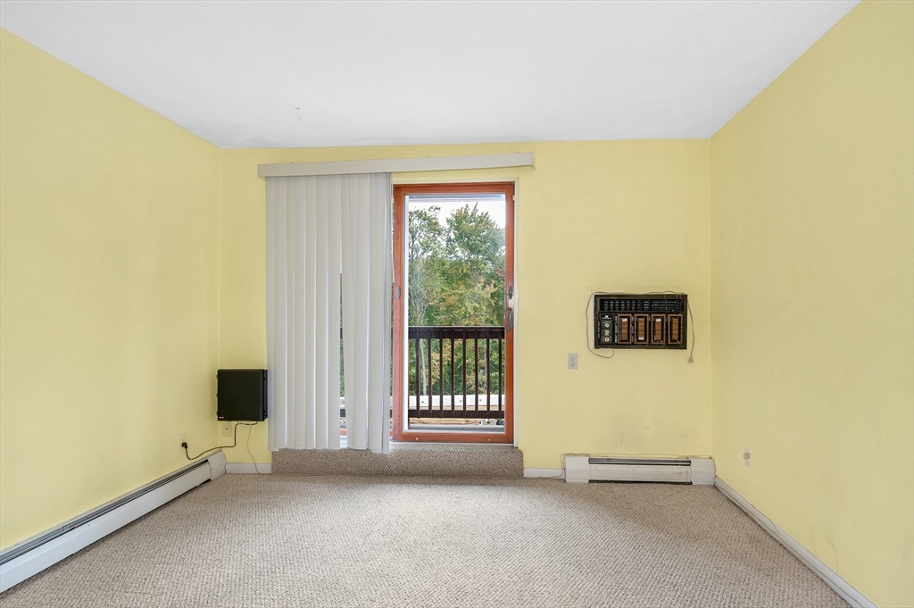 110 Boston Post Road East, Unit 104 Marlborough, MA 01752 - Photo 14 of 25 an empty room with windows