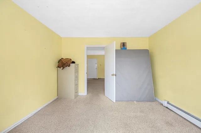 a view of balcony with wooden floor and fence