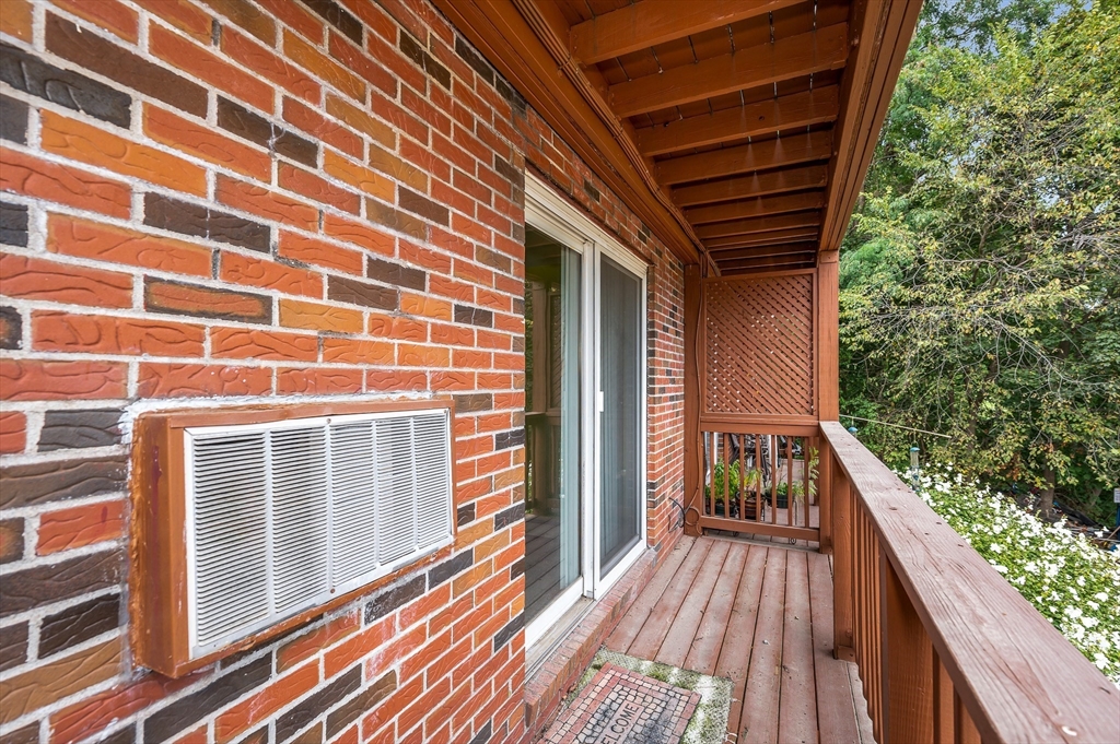 110 Boston Post Road East, Unit 104 Marlborough, MA 01752 - Photo 17 of 25 a view of balcony with wooden floor and fence