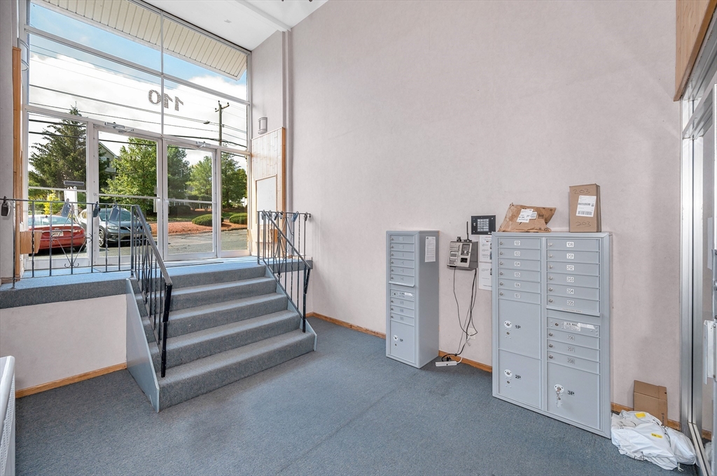 110 Boston Post Road East, Unit 104 Marlborough, MA 01752 - Photo 19 of 25 a view of room with cabinet and windows