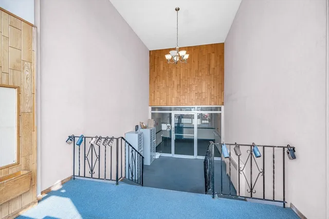 a front view of a residential apartment building with a yard