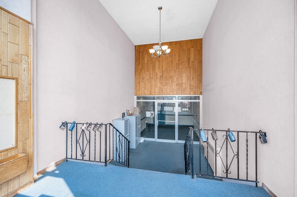110 Boston Post Road East, Unit 104 Marlborough, MA 01752 - Photo 20 of 25 a view of entryway and hall with wooden floor