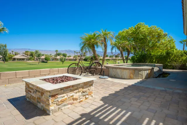 a view of a swimming pool with a table and chairs