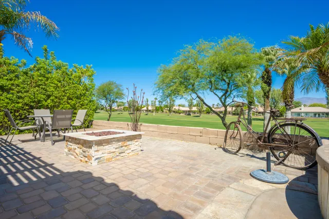 a view of a swimming pool and sitting area