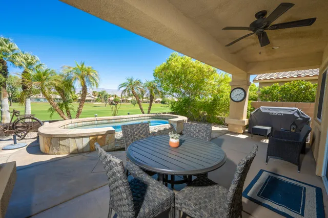 a view of a patio with a table chairs and a table