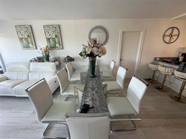 a spacious bedroom with a bed and a couch