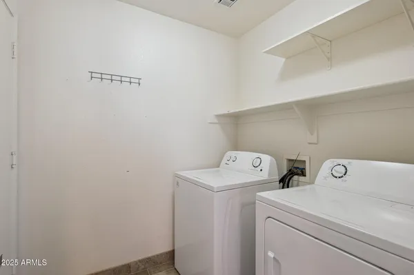 a bathroom with a granite countertop sink a toilet and a mirror