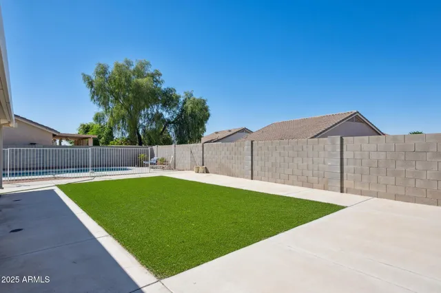 a front view of a house with patio and a garden