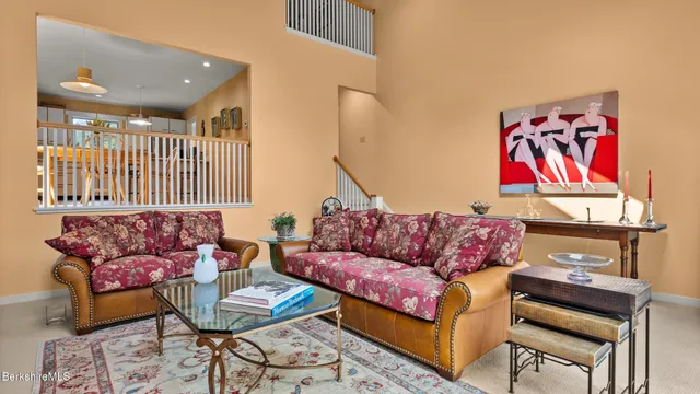 a living room with furniture and a rug