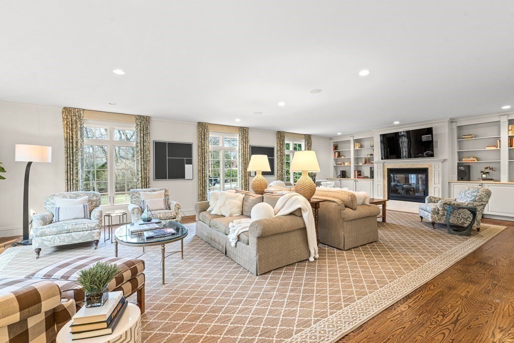 77 Cliff Road Wellesley, MA 02481 - Photo 13 of 33 a living room with furniture fireplace and a large window